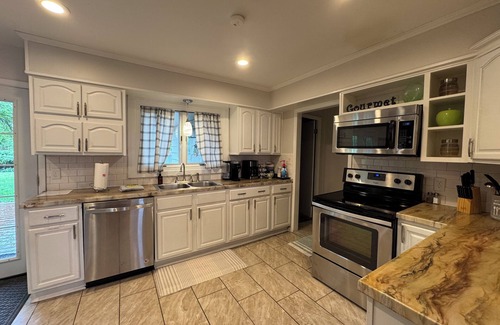 Wichita House | Near WSU: Bumper Pool and Fire Pit! Hosted by Homes by CNJ