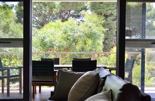 Port Willunga House | Nest, Cosy beach retreat, Midcentury beach shack firepit Netflix