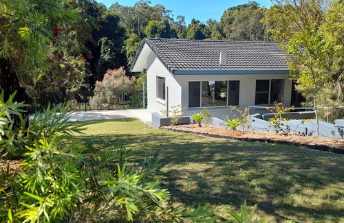 Red Rock House | Nestled in the heart of the serene seaside village of Red Rock.