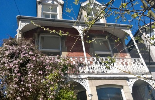 Swanage Apartment | Nestleton: Breakfast on the balcony or snuggle around the fire-dogs welcome too