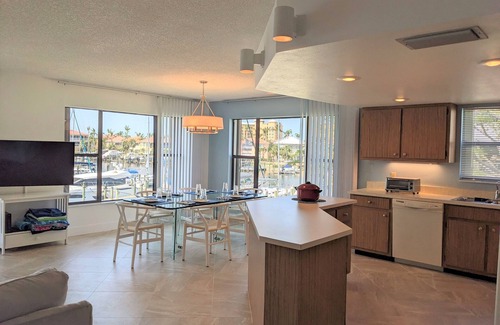 Burnt Store Marina Condo | NEW 2nd floor CORNER condo; Direct MARINA, MANATEE views, many upgrades.