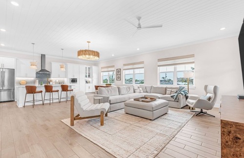 South Island House | NEW Build Modern Beach Beauty on Canal with Heated- Pool- 3 min to beach Access