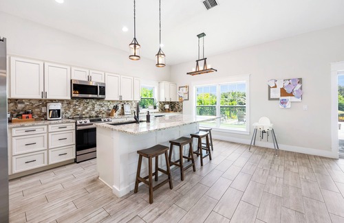 Jensen Beach House | New Construction Lakefront Home with Mini Golf Course, Heated Saltwater Pool!