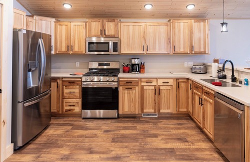 Eagle River House | NEW Construction Lake House with Paddle Boards, Kayaks, Shuffleboard & More!