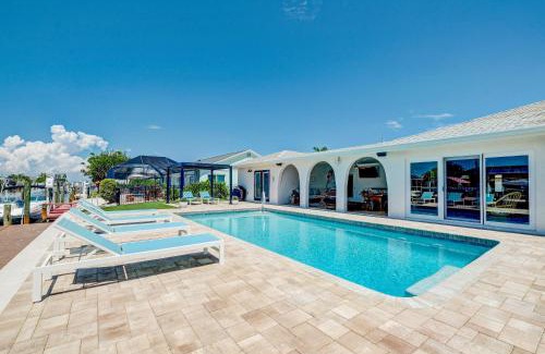 Whitney Beach House | NEW! Cortez Cabana! Canal front home with heated pool & boat dock!