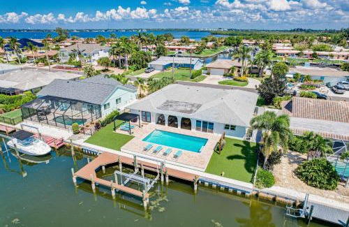 Whitney Beach House | NEW! Cortez Cabana! Canal front home with heated pool & boat dock!
