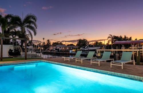 Whitney Beach House | NEW! Cortez Cabana! Canal front home with heated pool & boat dock!