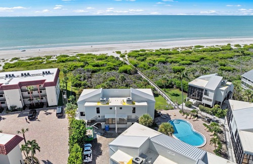 Sanibel House | New Cyprina Unit #2 – a fully renovated, Serena & Lily–inspired townhome on Sanibel’s sought-after East End. This luxury beach retreat seamlessly blends coastal elegance with modern comfort, offering breathtaking direct water views from every room.