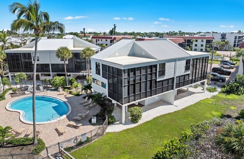 Sanibel House | New Cyprina Unit #2 – a fully renovated, Serena & Lily–inspired townhome on Sanibel’s sought-after East End. This luxury beach retreat seamlessly blends coastal elegance with modern comfort, offering breathtaking direct water views from every room.