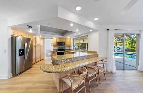 Palm River Estates House | New Listing Discount! Tropical Bliss - Heated Pool, 5 miles to Vanderbilt Beach!