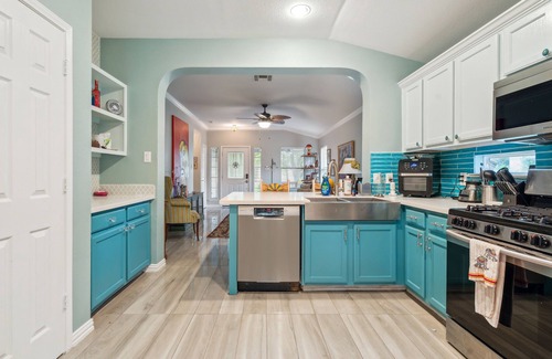 Kyle House | NEW LISTING! Eclectic Oasis: Artful & Colorful Comfort by RedAwning