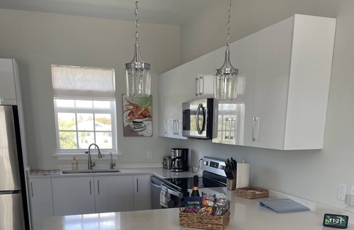 Palm Cay Condo | New Luxury 3 bedroom villa steps from the beach.