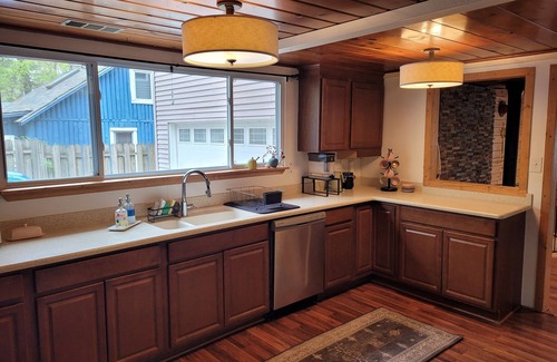 National City House | New! Seven Oaks at Bass Lake - Beautiful Lakefront Getaway with Dock and Canoe!