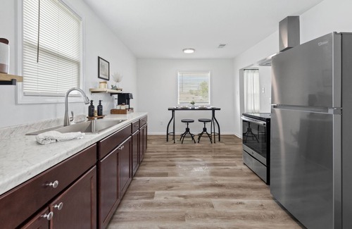 Lake Charles House | New! Work. Rest. Play. Stay at Pelican Suites