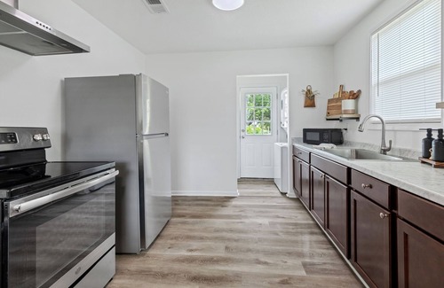 Lake Charles House | New! Work. Rest. Play. Stay at Pelican Suites