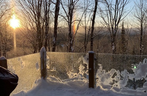 Lac Superieur Village Ski Chalet | Newly renovated log home with private spa and lake access.