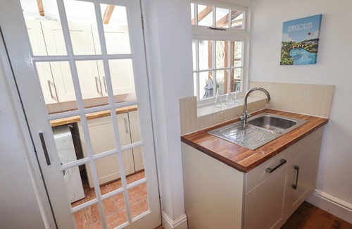 Llangollen Cottage | NO. 9 ON THE RIVERBANK, pet friendly, with open fire in Llangollen