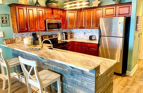 West Panama City Beach Condo | Ocean Front Paradise with Million Dollar Sunset Views and Free Beach Chairs!