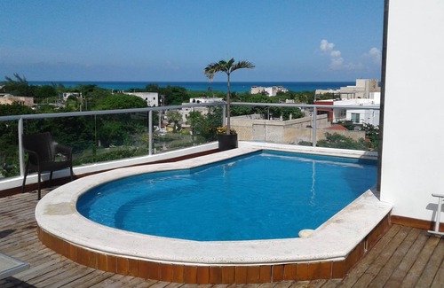 Luis Donaldo Colosio Condo | Ocean view condo with rooftop pool near the beach