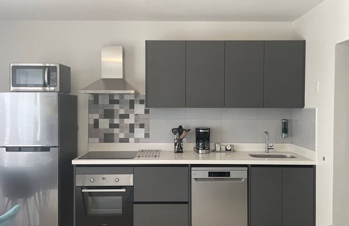 Oranjestad Condo | Oceanfront 1-BDR Condo: King-Bed|Pool|Full-Kitchen|Sofa-Bed|Mini-Beach|Dock