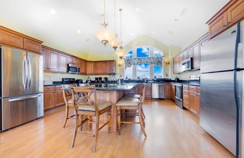 Ocean Isle Estates House | Oceanfront Home with Hot Tub, Pool, Putting Green, Elevator, and Game Room
