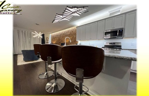 Durham House | Oceanna Drive a TESLA during your all-inclusive stay!