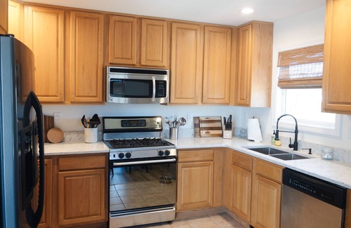Kill Devil Hills House | Oceanside 4BR Home, Fenced Backyard, Hot Tub, 5 Min Walk to Beach!