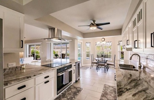 Fort Myers House | Offering breathtaking views of the sun setting over the water.