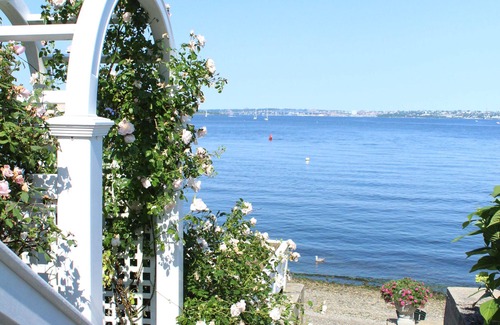 Bristol Cottage | Old fashioned designer front porch living by the sea with expansive water views.