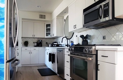 Southwest Village House | Old Town Scottsdale modern decor big pool hot tub TV on patio Comfort Convenient