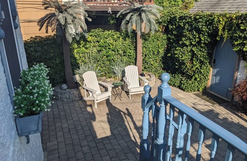 Long Beach House | "Once Upon a Tide" eclectic beach house with pizza oven, game room, fireplace