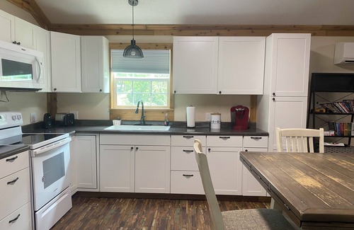 Anacoco Cabin | One bedroom with lake view.