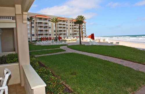 New Smyrna Beach Condo | One of a kind ground floor, three bedroom, three bath corner. Amazing south east ocean views.