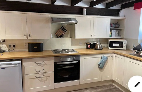 Lanhydrock Cottage | Oozing charm! Character Cottage - Dog Friendly With Luxury Hot tub & Log Burner