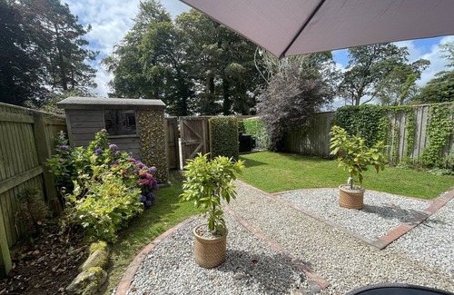 Lanhydrock Cottage | Oozing charm! Character Cottage - Dog Friendly With Luxury Hot tub & Log Burner