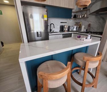 Riomar Apartment | Open Floor Chic Interior Design Pool Full Kitchen