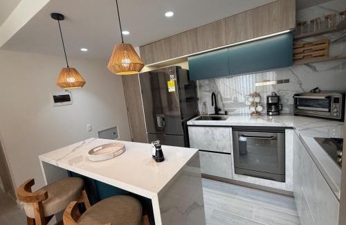 Riomar Apartment | Open Floor Chic Interior Design Pool Full Kitchen