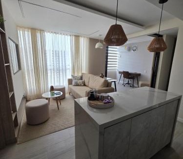 Riomar Apartment | Open Floor Chic Interior Design Pool Full Kitchen