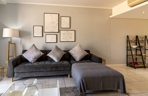 Victoria and Alfred Waterfront Apartment | Opening into a balcony with garden views, the air-conditioned 2bedroom apartment