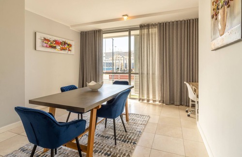 Victoria and Alfred Waterfront Apartment | Opening into a balcony with garden views, the air-conditioned 2bedroom apartment