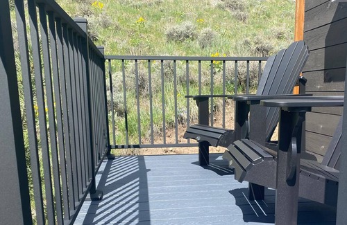 Red Lodge House | Our comfortable tiny cabin features Big amenities: Plush queen bed, galley kitchen, T.V., Internet, Fireplace & private bathroom, with shower & composting toilet. Large deck with seating areas, Bbq grill, table with umbrella & chairs. Plus lots of Vi
