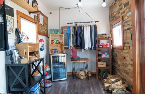 Meeker House | Our largest "not so tiny" tiny home, White River Casita is a beautiful modern tiny home that features a Queen bed on main level, one Queen bed in loft accessible by stairs, one Queen fold out couch with additional sleeping space in loft for sleeping