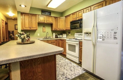Aberdeen House | OurCozyOasis, Relax in the warmth of the fireplace in this homey upstairs.