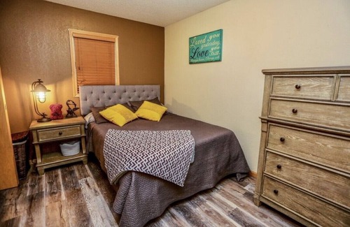 Aberdeen House | OurCozyOasis, Relax in the warmth of the fireplace in this homey upstairs.