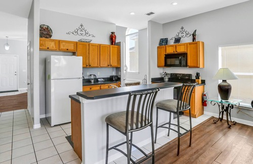 Marbella House | Palm-lined home with enclosed pool, game room, washer/dryer & AC - dog-friendly