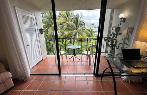 Williams Town Condo | Palm Tree Cove - Stunning Partial Ocean Views; Beachfront Location!