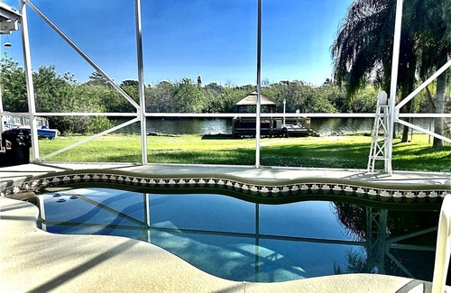 Tillman House | Palms Paradise. Heated Pool. Waterfront. Near Space Coast Beaches.
