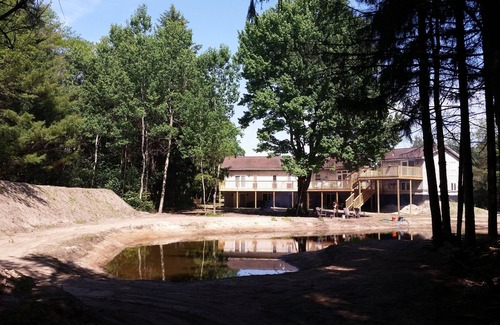 Norton Shores Apartment | Paradise Cove Lighthouse 2 br 1 bath on storage pond ~ sleeps 6