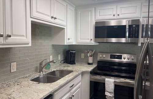 Mid America Condo | Paradise Found: Condo Oasis Reveals Stunning Pool and Lake Views!"