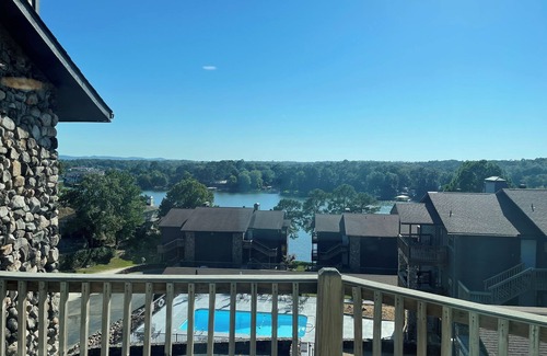 Mid America Condo | Paradise Found: Condo Oasis Reveals Stunning Pool and Lake Views!"